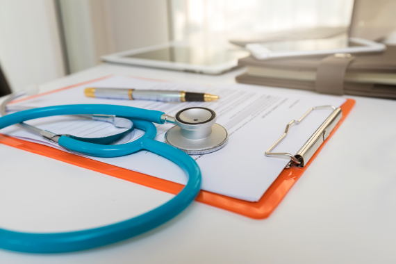 close-up-of-stethoscope-and-paper-clipboard-on-des-2022-10-04-16-48-47-utc close-up-of-stethoscope-and-paper-clipboard-on-des-2022-10-04-16-48-47-utc