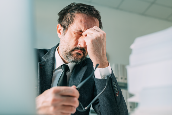 migraine-at-work-businessman-with-severe-painful-2022-04-12-06-48-41-utc migraine-at-work-businessman-with-severe-painful-2022-04-12-06-48-41-utc