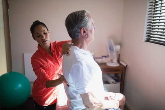 young-female-therapist-massaging-back-of-senior-ma-2021-08-28-17-23-05-utc young-female-therapist-massaging-back-of-senior-ma-2021-08-28-17-23-05-utc